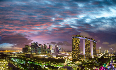Fototapeta premium Sunset aerial view of Singapore from drone, view from Gardens By The Bay
