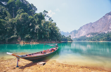 Fototapeta na wymiar Khao Sok National Park, Surat Thani, Thailand. It includes Cheow Lan Lake contained by the Ratchaprapha Dam. It is the largest area of virgin forest in southern Thailand and a remnant of rain forest.