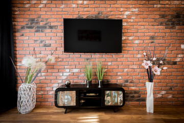 tv on wall brick