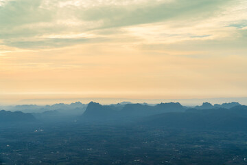 Sunrise at mountain cliff with mountain background. Nature park and outdoor landscape background