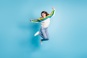 Obraz premium Full size photo of optimistic nice brunette lady jump wear sweater jeans shoes isolated on blue background