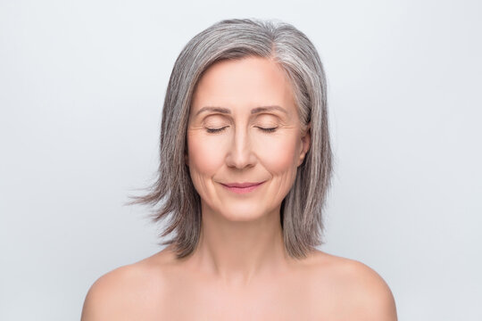 Photo of calm peaceful old woman closed eyes skin body care clear face treatment isolated on grey color background