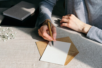 Woman writing romantic letter or wedding invitation card - obrazy, fototapety, plakaty
