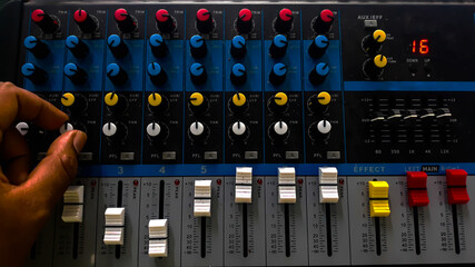 studio sound mixer console board panel with recording , faders and adjusting knobs, TV equipment
