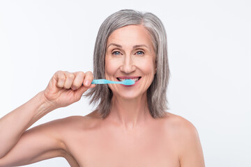 Portrait of attractive nude healthy woman brushing teeth fresh breath anti caries isolated over gray pastel color background