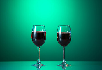 Red wine in the glass on the table. reflected glass. Summer mood