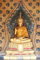 Golden buddha statue at a temple in Thailand.