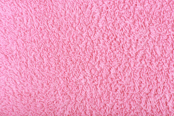 Pink fuzzy fabric close up. Fleece cozy towel background with space for text - obrazy, fototapety, plakaty