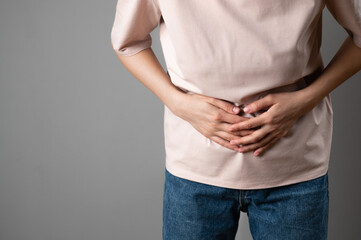 The woman has a stomach ache