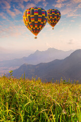 Balloon and mountain,Hot air balloon above high mountain at sunset, filtered backgroun
