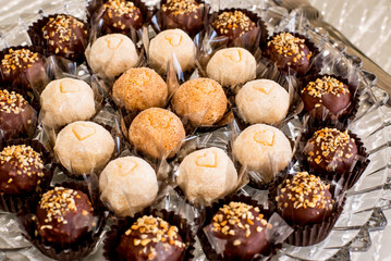 Table with traditional Brazilian party sweets. Chocolate, brigadeiro and condensed milk.