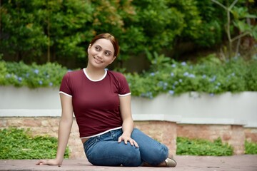 Happy Attractive Diverse Female Adult Wearing Tshirt Sitting
