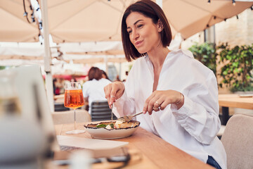Woman Making Video Call And Eating Salad