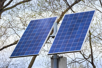 Solar battery generates clean green energy for lanterns in public park closeup. Concept of environmental conservation, combating pollution and greenhouse effect innovations and new technologies
