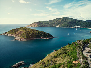 Fototapeta premium Beautiful landscape with ocean shore, small green island. Phuket, Thailand. Aerial drone view.