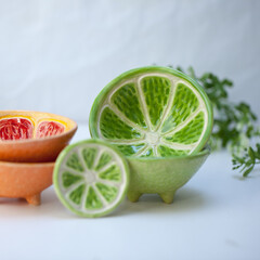 Ceramic cup in the form of half a lime.