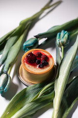 Cheesecake with berries on a white background