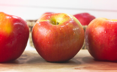 Apple put on wooden timber board,
