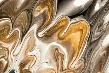 Abstract fluid art background beige and brown colors. Liquid marble. Acrylic painting with white lines and gradient.
