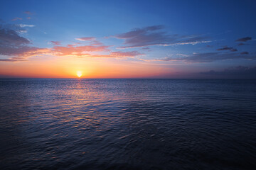 Beautiful seascape with sunset cloudy sky.