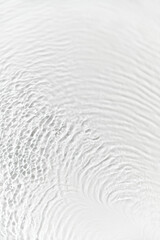 Water background. White transparent water texture, off white water surface with rings and ripple....