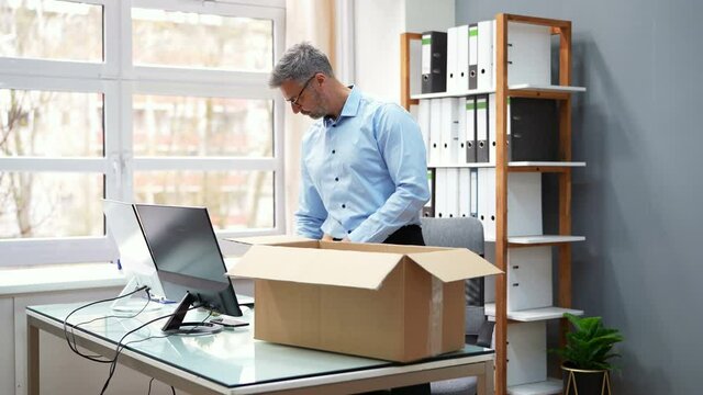 Job Quit. Employee Packing Cardboard Box