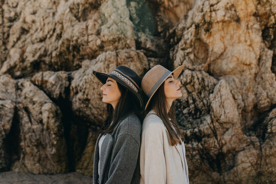 Young Sisters Back To Back By Rock Formation