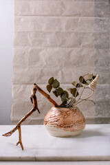 Dry flowers and twigs branch in ceramic vase