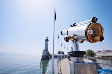 Coin Operated Spyglass viewer next to the lakeside promenade looking out to the bay on Lindau's harbor.