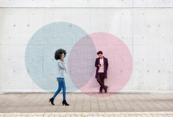 Graphic visualization of data exchanged by man and woman using smart phones outdoors