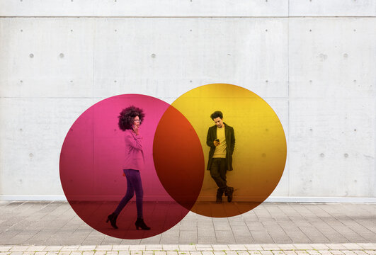 Two overlapping circles visualizing social distancing covering man and woman using smart phones outdoors