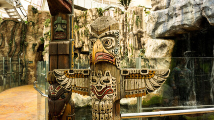 Totem pole in the jungle. Animal totems in the Minsk zoo. May 2, 2021