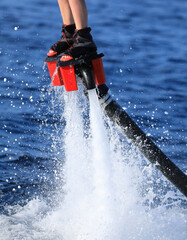Naklejka premium Water extreme sport, Flyboard, surfing in ocean