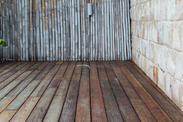The bamboo wall, stone tiles wall and wooden floor in the hotel resort.