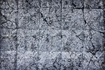 Obraz premium Cracked old concrete wall texture. Broken rough cement surface. Dark gray gloomy grunge abstract background