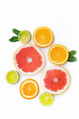 Fototapeta na wymiar Citrus fruits on a white background are cut . Colored fruits. The citrus family. citrus sliced layout top view on a white background. An article about healthy eating. Keto diet.