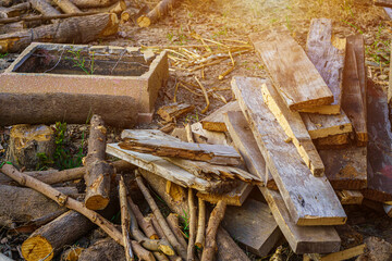 Old plank and pile of chopped Firewood for the winter and prepared for winter Pile of wood logs prepared for heating the house