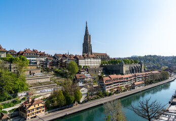 a view of the cathedral in Bern and the old town along the Aare River