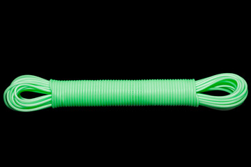Colored plastic cord insulated on a black background. twisted cable