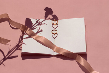 Blank wedding book rings carnations ribbon