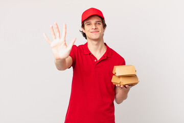 burger deliver man smiling and looking friendly, showing number five