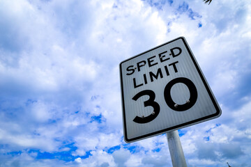 speed limit sign on blue sky