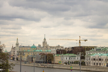 Fototapeta premium panoramic view of the Moskva River and the Sofia embankment with historical buildings against a cloudy sky and space to copy. Concept - famous place in Moscow Russia