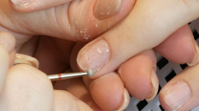 Special manicure tools polish and trim cuticles on nails at home close up view