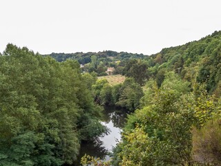 Fototapeta na wymiar trees reflecting in the river in rural France