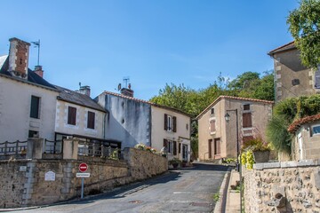 Fototapeta na wymiar pretty street of old houses in Queaux France