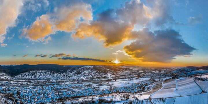 Germany, Baden Wurttemberg, Remstal, Aerial view of mountain landscape in winter at sunrise