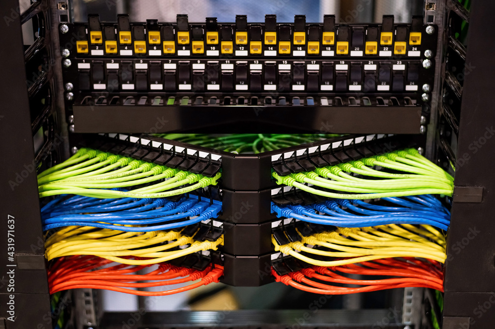 Wall mural multi-colored rows of network cables are connected to the system