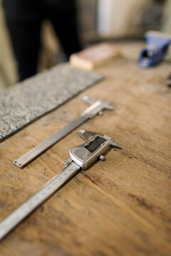 Vernier callipers on table in workshop