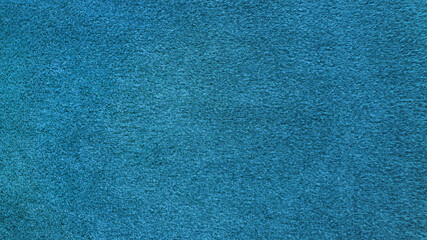 bright blue soft velvet fabric texture used as background. empty blue or cyan fabric background of...